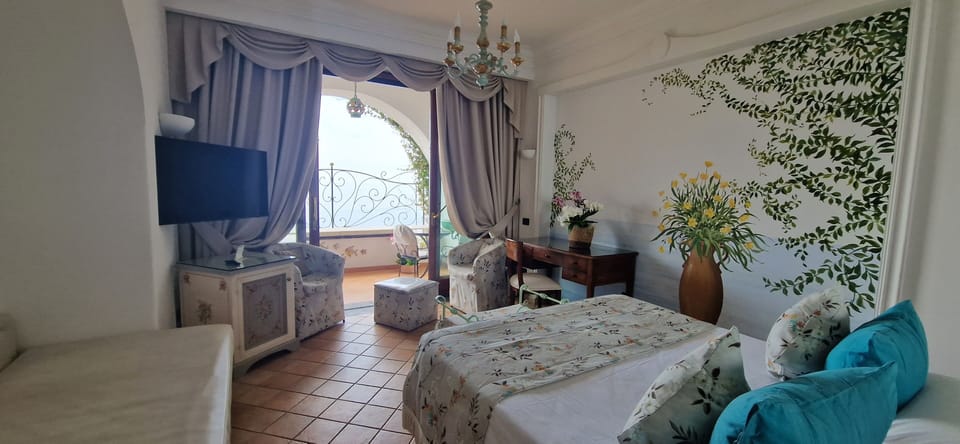 Deluxe Room, 1 Bedroom, Sea View | Minibar, in-room safe, desk, blackout drapes