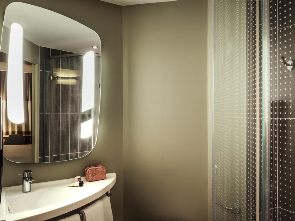 Premium bedding, desk, laptop workspace, blackout drapes