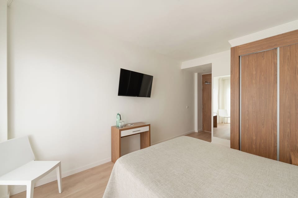 Minibar, desk, blackout drapes, iron/ironing board