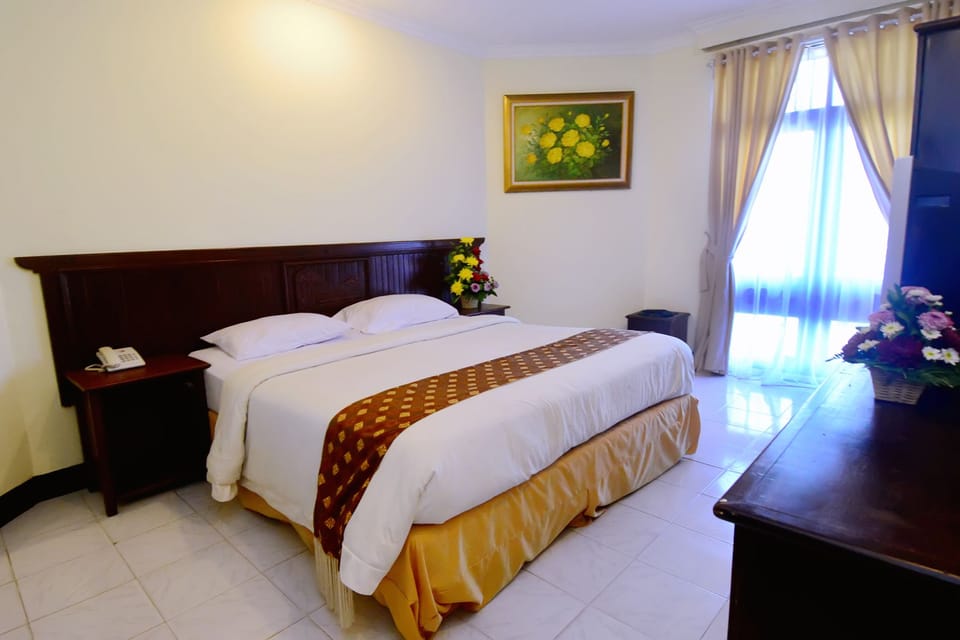 Deluxe Room, Beachfront | In-room safe, desk, soundproofing, iron/ironing board