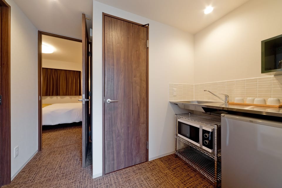 Deluxe Double Room | Private kitchen | Fridge, microwave