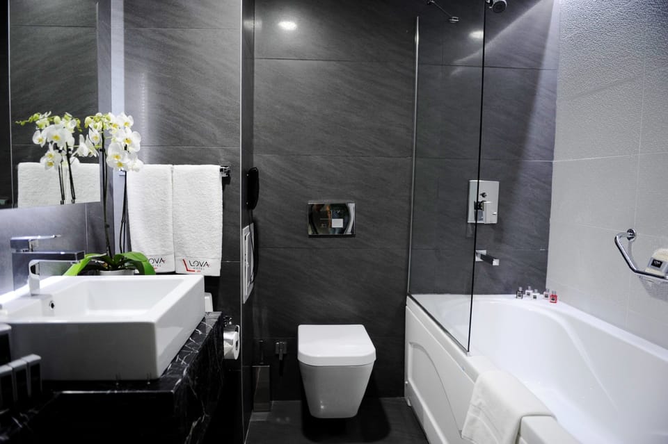 Bathtub, deep soaking tub, designer toiletries, hair dryer