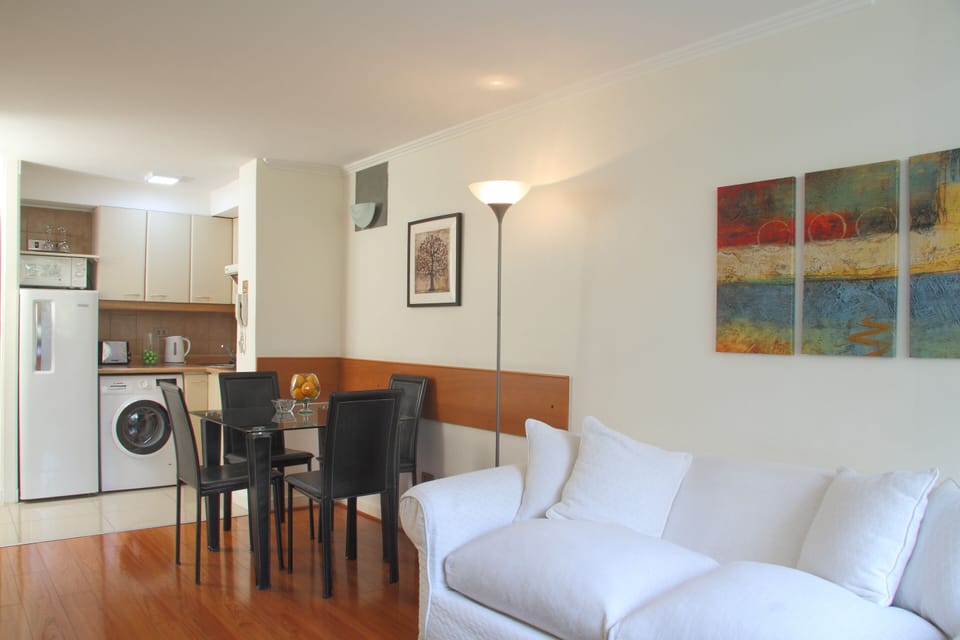 Business Apartment, 1 Bedroom | Living room | 25-inch flat-screen TV with cable channels, TV, DVD player