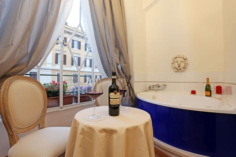 Deluxe Suite, 1 Queen Bed, Hot Tub | Premium bedding, minibar, in-room safe, laptop workspace