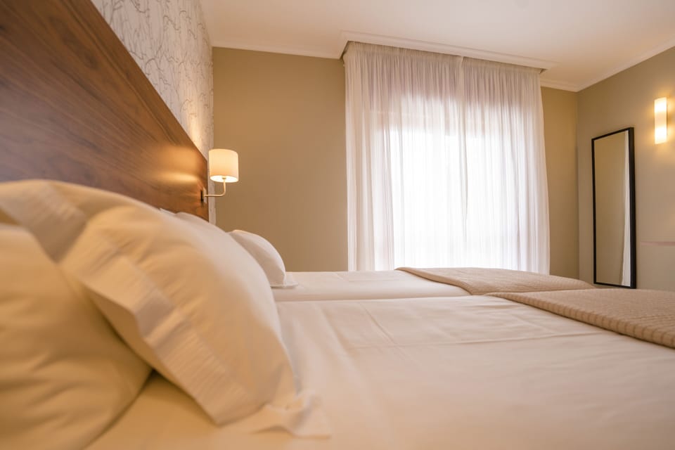 Desk, laptop workspace, blackout drapes, free cribs/infant beds