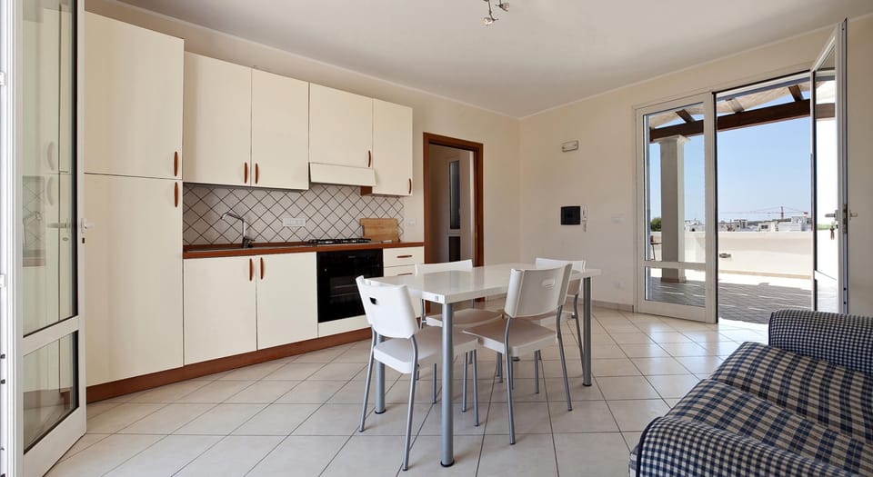 Apartment, 2 Bedrooms | Private kitchen | Full-size fridge, oven, stovetop, cookware/dishes/utensils