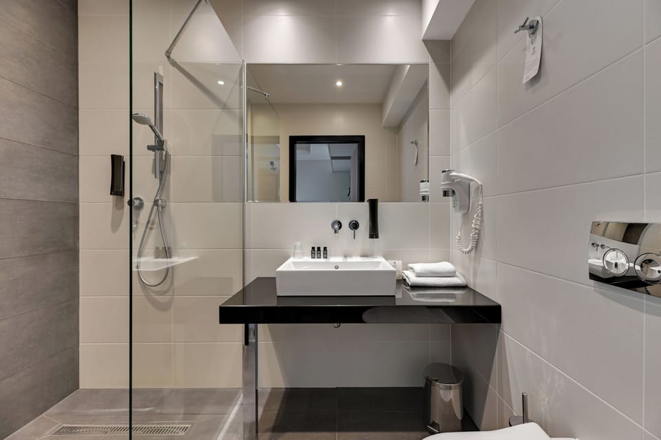 Single Room | Bathroom | Designer toiletries, hair dryer, bathrobes, slippers