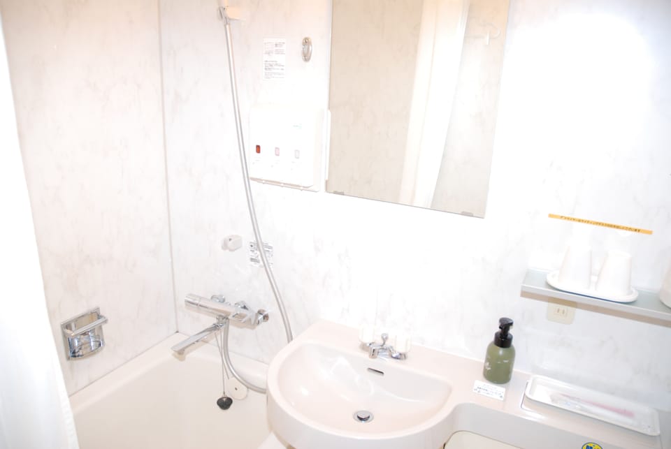 Combined shower/tub, free toiletries, hair dryer, bathrobes