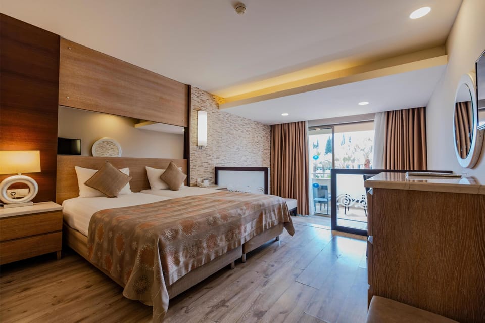 Family Room | Free minibar, in-room safe, desk, free WiFi
