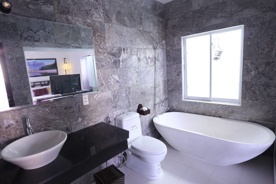 Designer toiletries, hair dryer, slippers, bidet