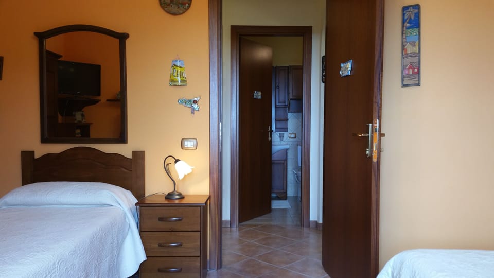 Comfort Triple Room, Sea View (Carlo magno) | Down comforters, desk, iron/ironing board (on request), WiFi (free)