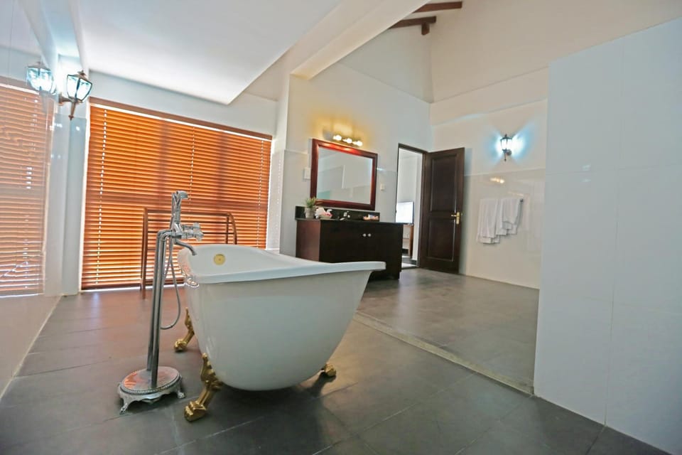 Separate tub and shower, deep soaking tub, free toiletries, towels