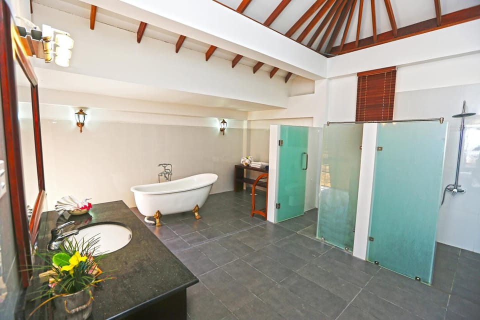 Separate tub and shower, deep soaking tub, free toiletries, towels