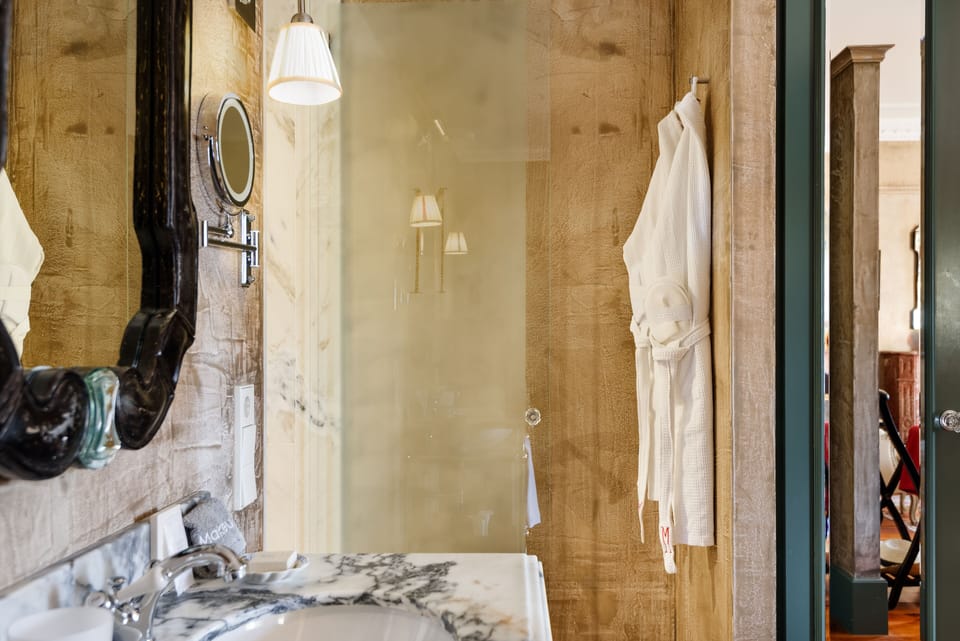 Suite, City View | Bathroom | Shower, free toiletries, hair dryer, bathrobes