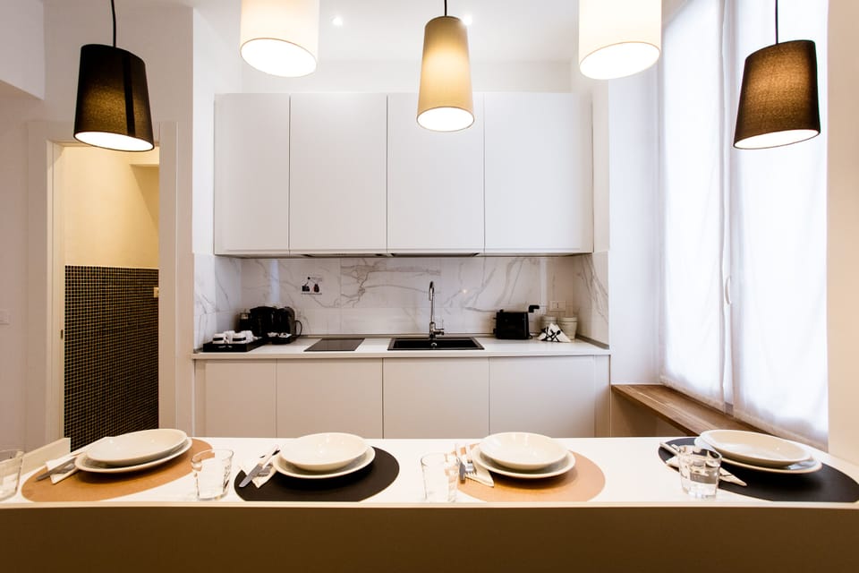 Junior Studio Suite (Via Di Monale 75) | Private kitchen | Coffee/tea maker, electric kettle, dining tables