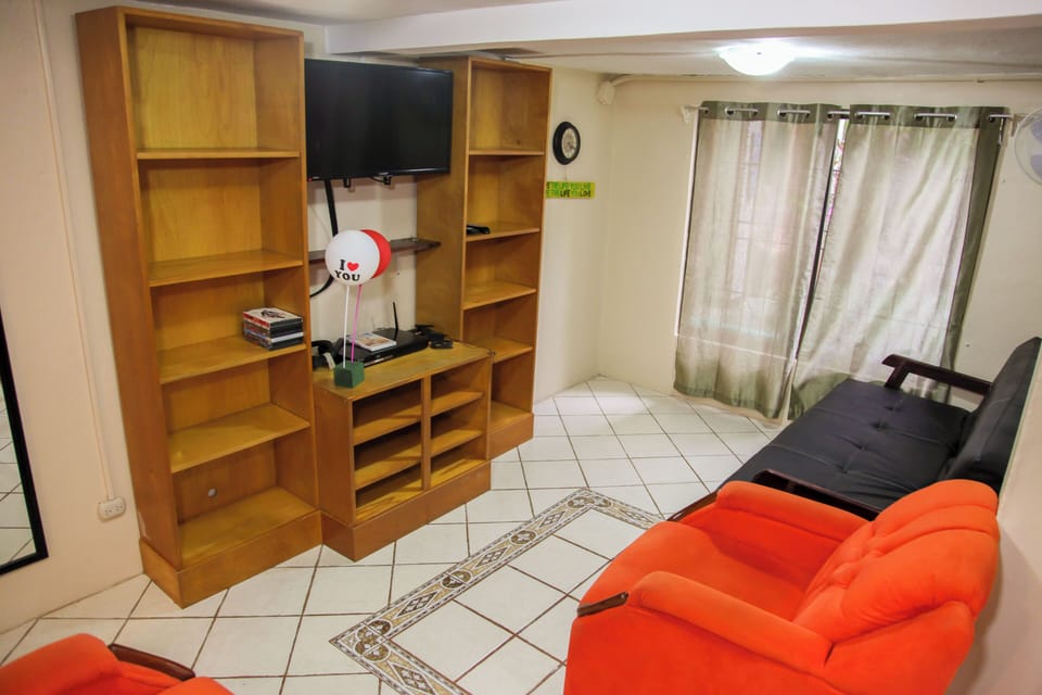 Deluxe Condo, Kitchen, Ground Floor | Living room | Flat-screen TV