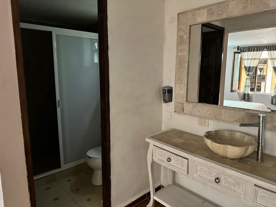 Shower, slippers, towels, soap