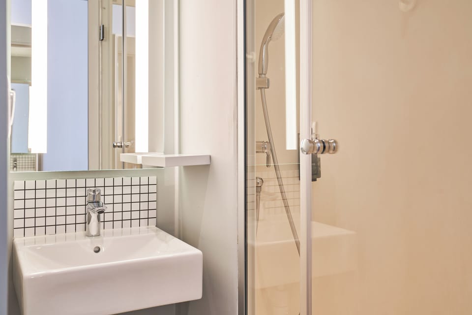 Shower, eco-friendly toiletries, hair dryer, towels