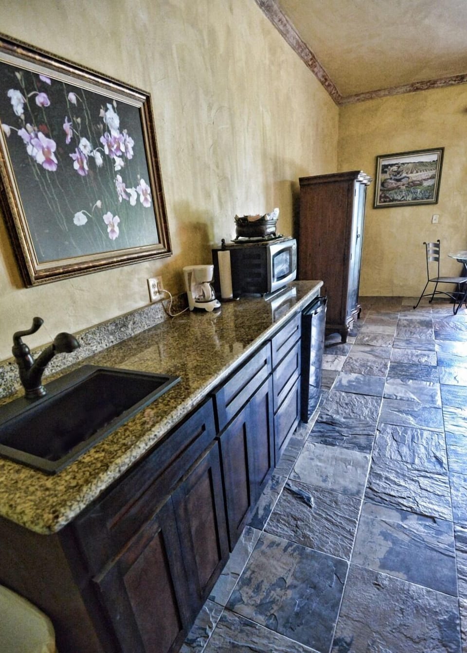 Fridge, microwave, coffee/tea maker, cookware/dishes/utensils