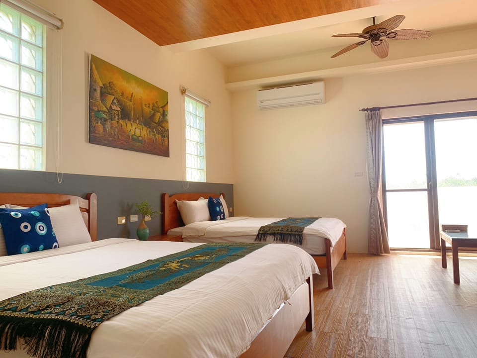 Standard Quadruple Room, 2 Queen Beds, Balcony | Blackout drapes, free WiFi, bed sheets