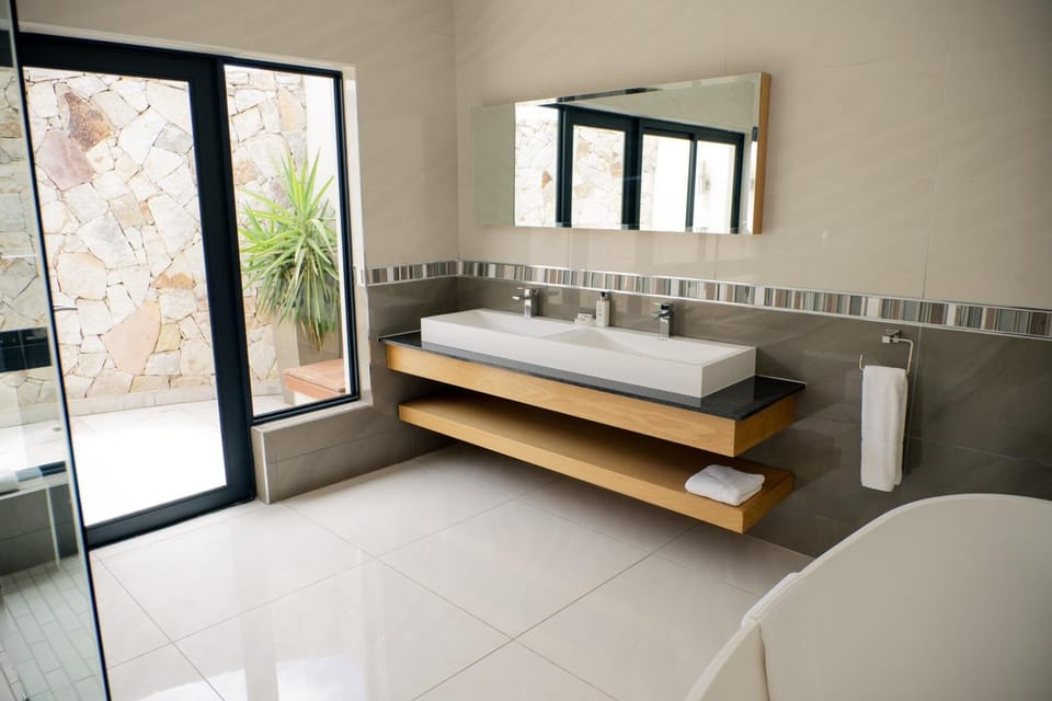 Separate tub and shower, free toiletries, hair dryer, bathrobes