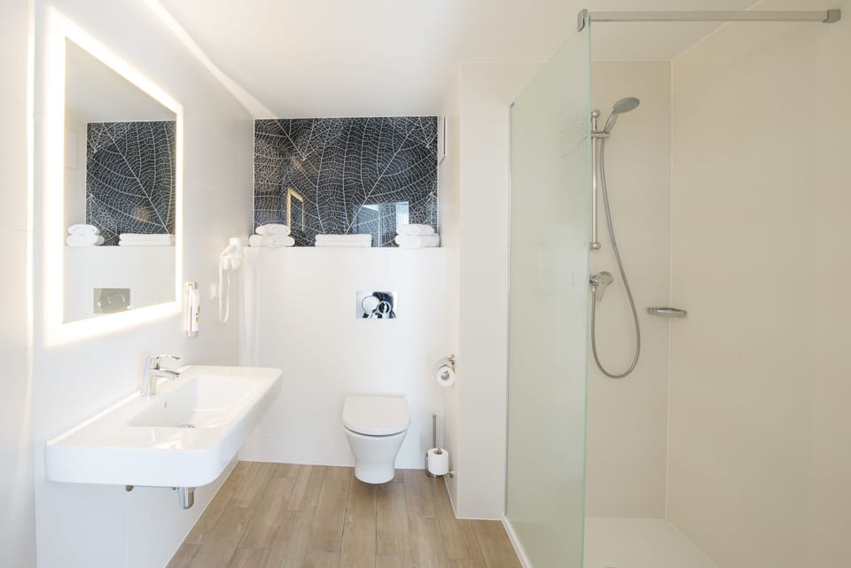 Shower, eco-friendly toiletries, hair dryer, towels