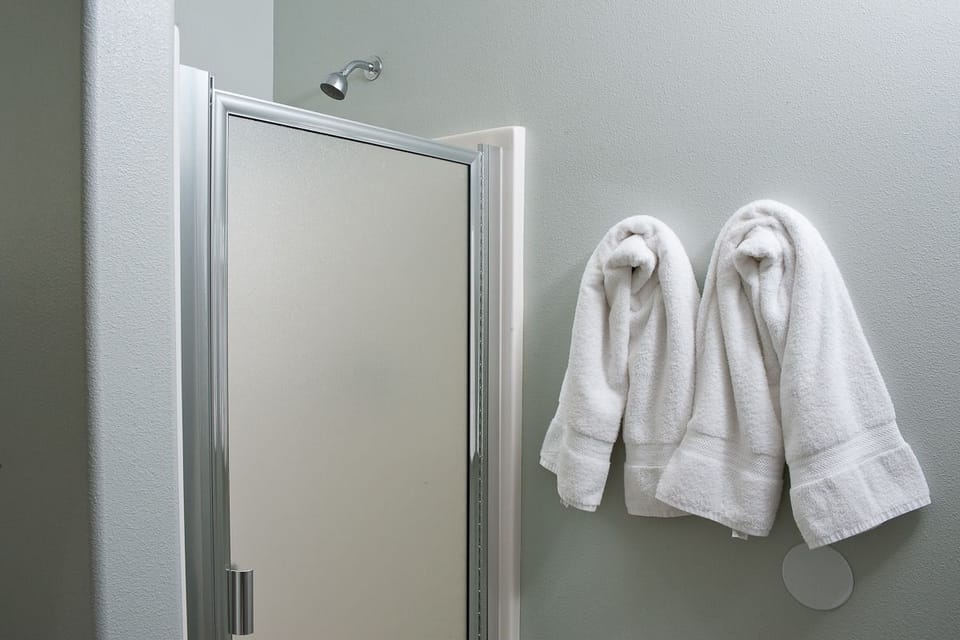 Second Floor Condo, 2 Bedrooms, Kitchen, Ocean View (Snuggle Inn) | Bathroom | Free toiletries, hair dryer, towels