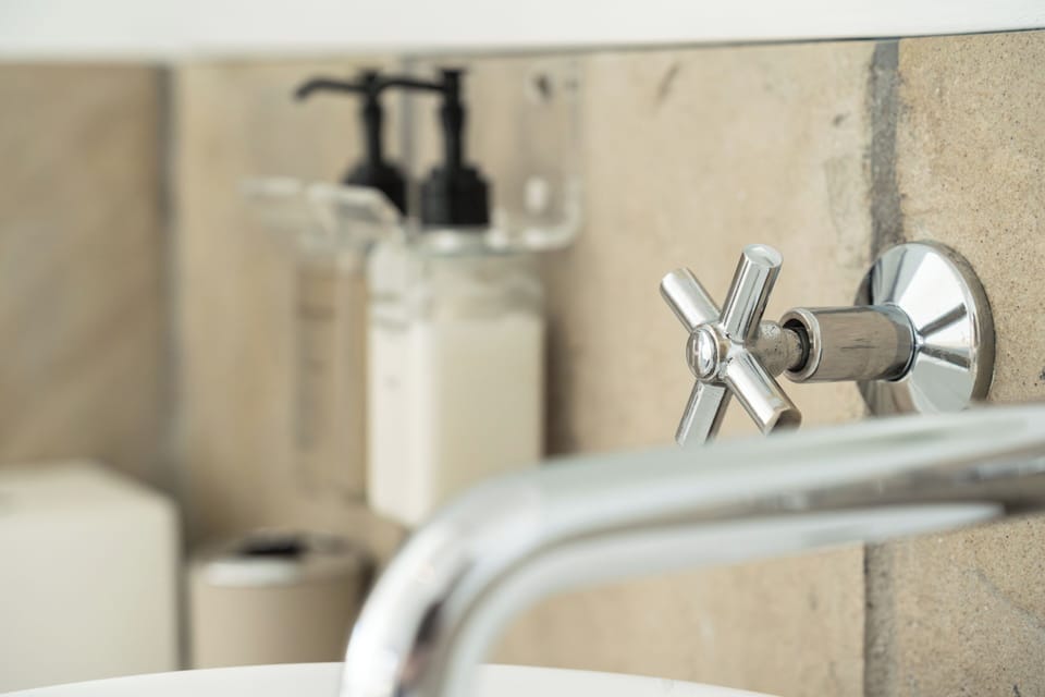 Sea View Room - Open plan bathroom (1) | Bathroom | Shower, hair dryer, towels, soap