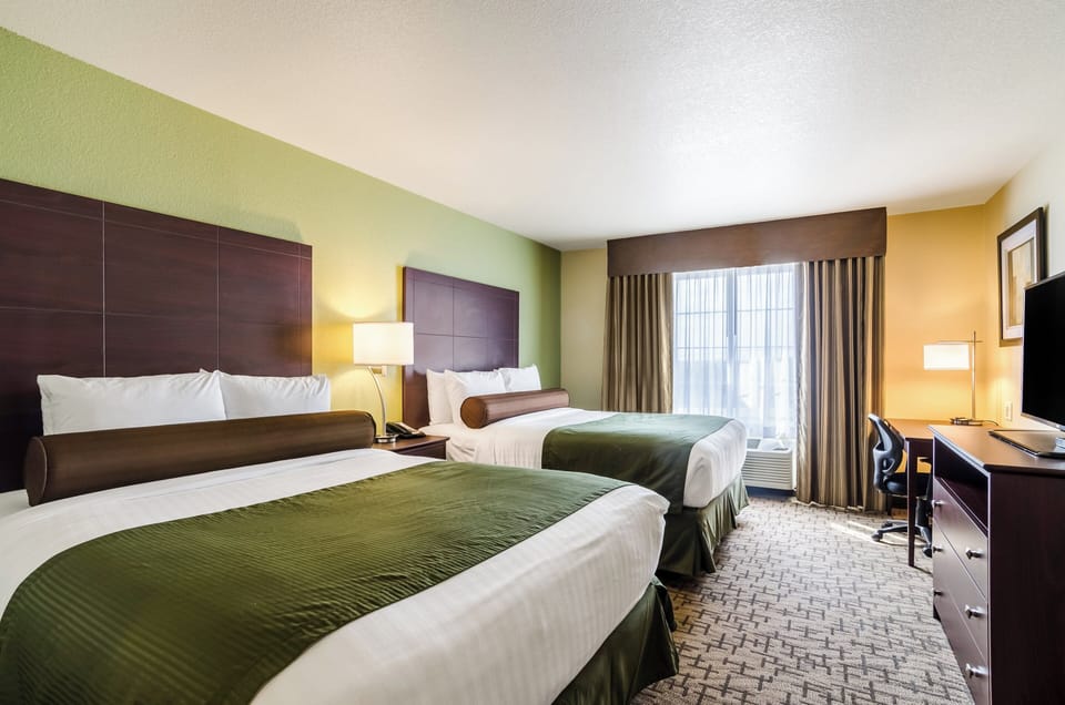 Premium bedding, pillowtop beds, desk, laptop workspace