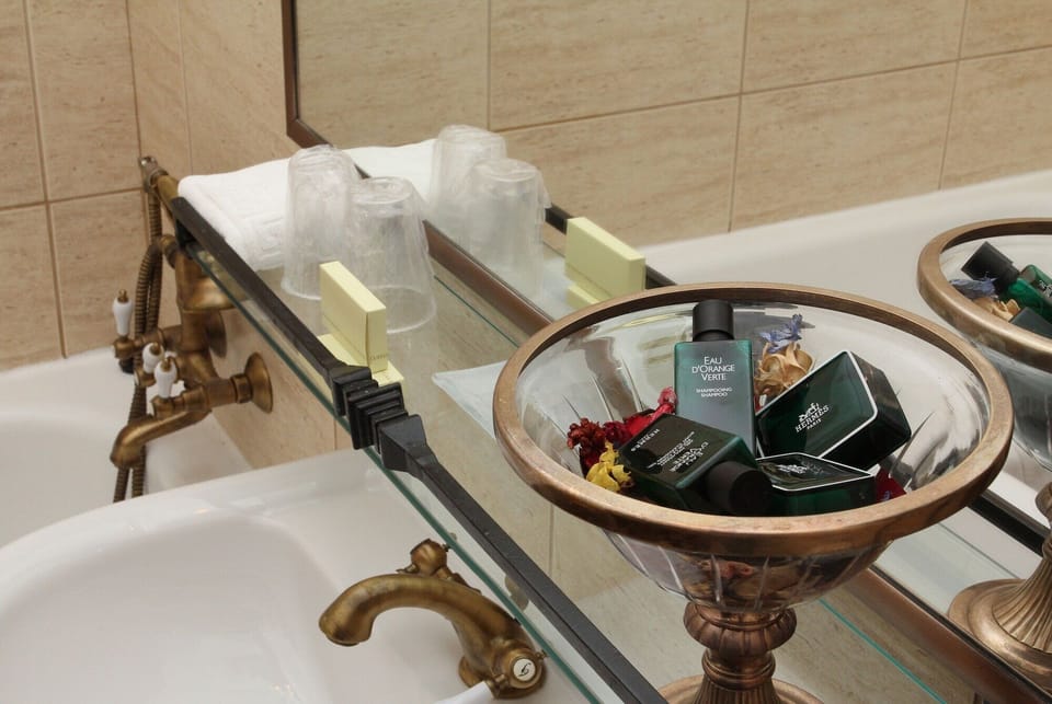 Bathroom | Deep soaking tub, free toiletries, hair dryer, bathrobes