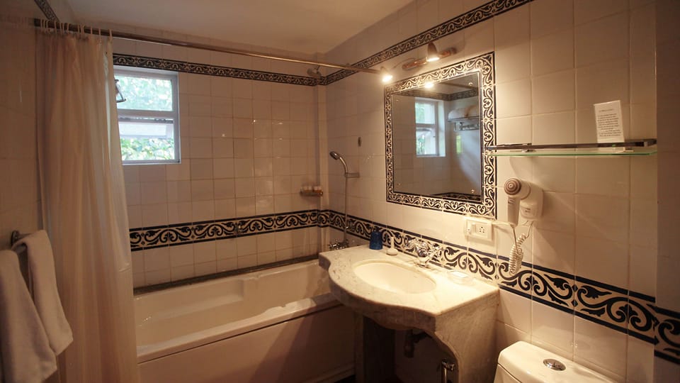 Junior Suite with Free Bike Rental | Bathroom | Free toiletries, hair dryer, slippers, towels
