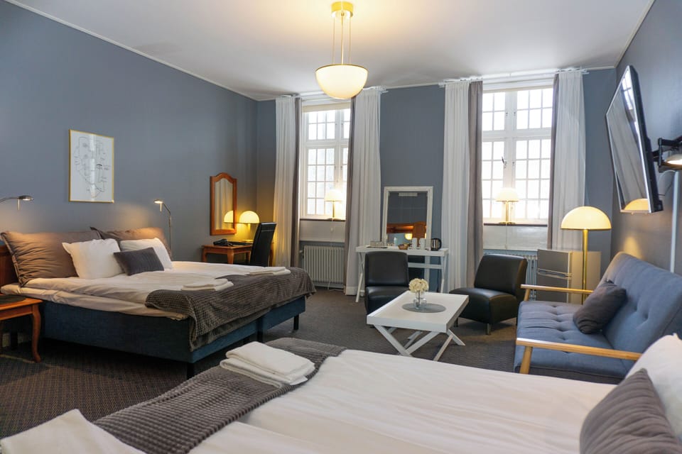 Family Room | Desk, laptop workspace, iron/ironing board, free cribs/infant beds