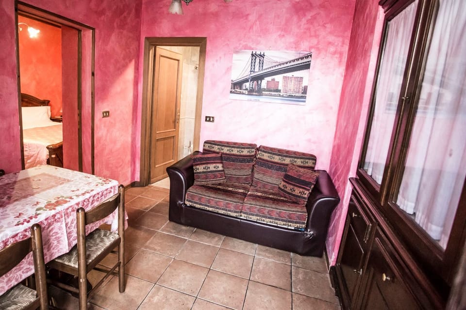 Apartment, 4 Bedrooms | Living area | Flat-screen TV