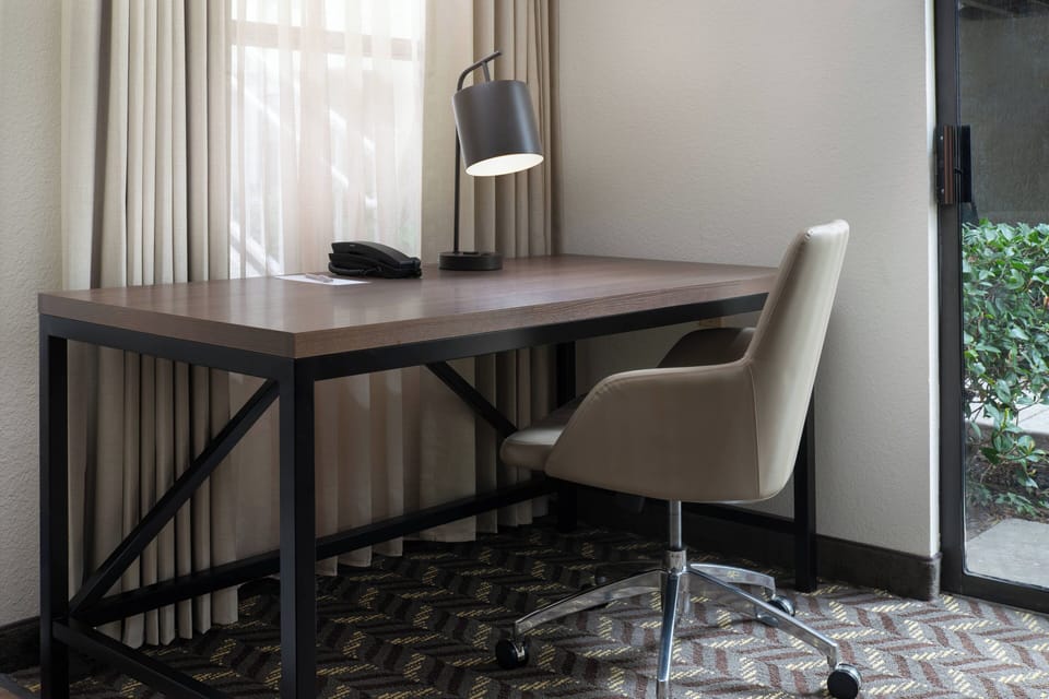 Desk, laptop workspace, blackout drapes, soundproofing