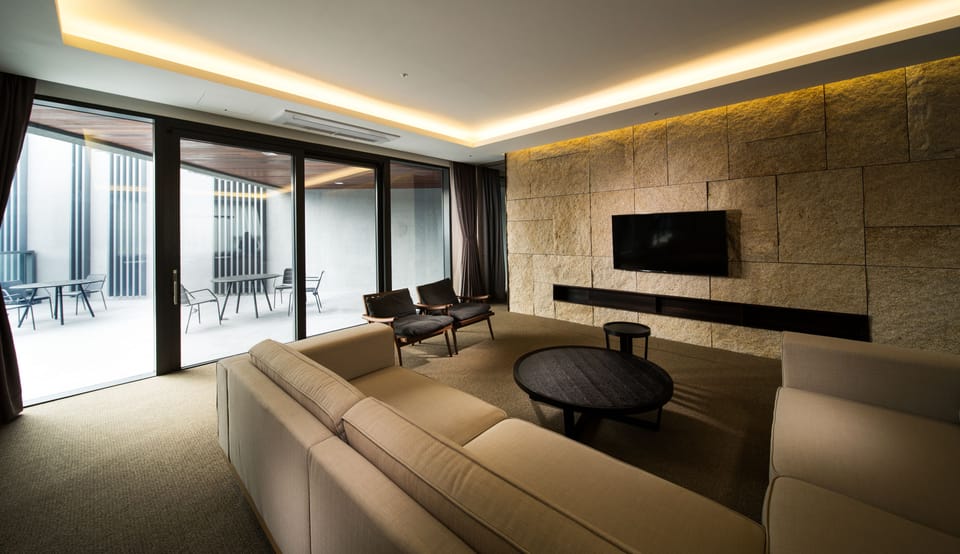 Suite (B) | Living area | 50-inch LCD TV with cable channels, TV, pay movies