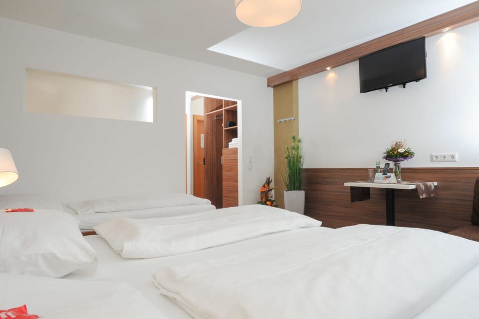 Triple Room | Premium bedding, in-room safe, desk, blackout drapes