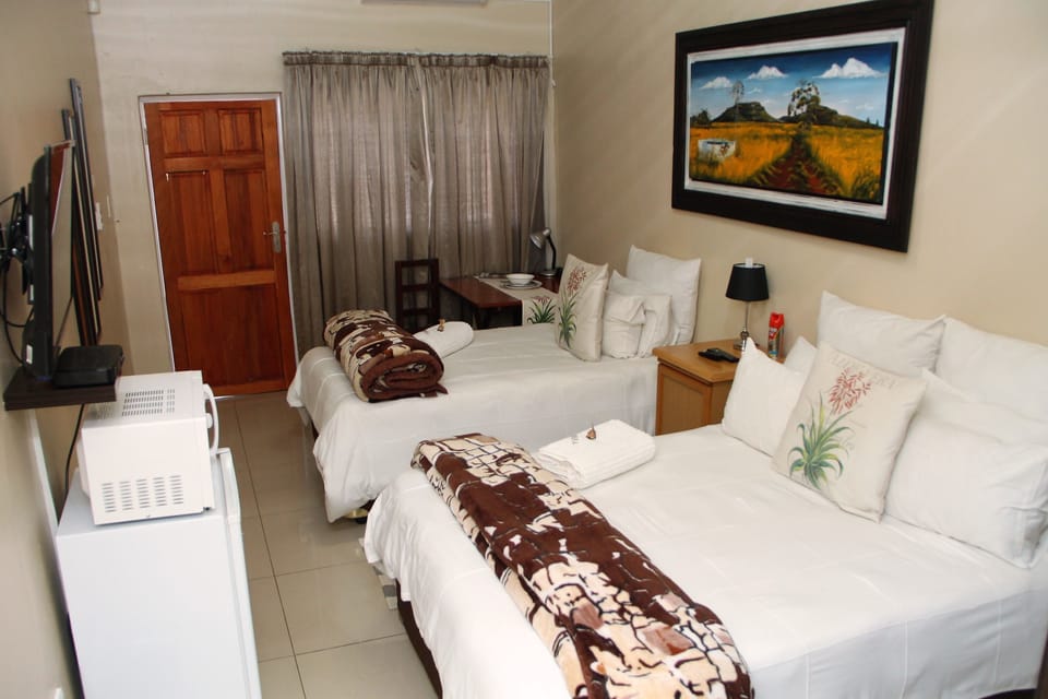 Family Room, 3 Bedrooms, Refrigerator & Microwave | In-room safe, desk, soundproofing, iron/ironing board