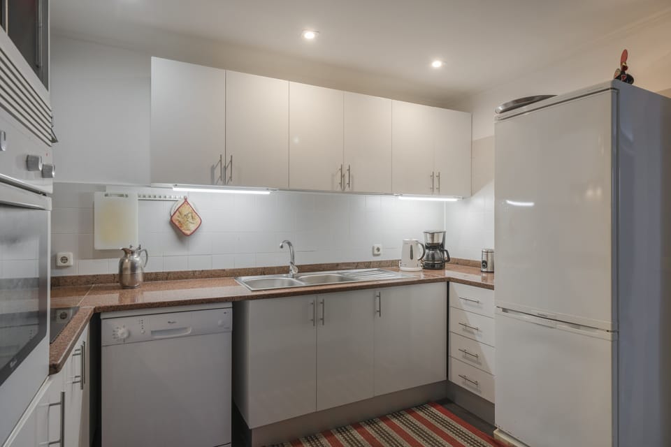 Full-size fridge, stovetop, electric kettle, toaster