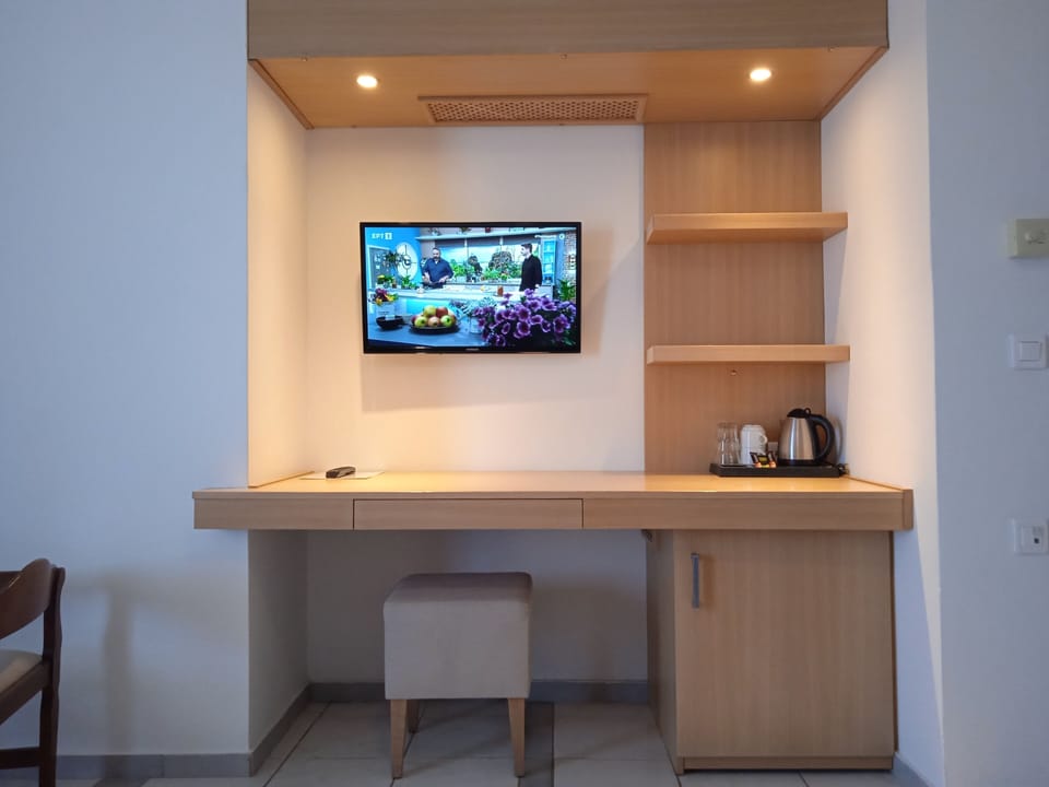 Suite, Balcony, Sea View | Living area | TV