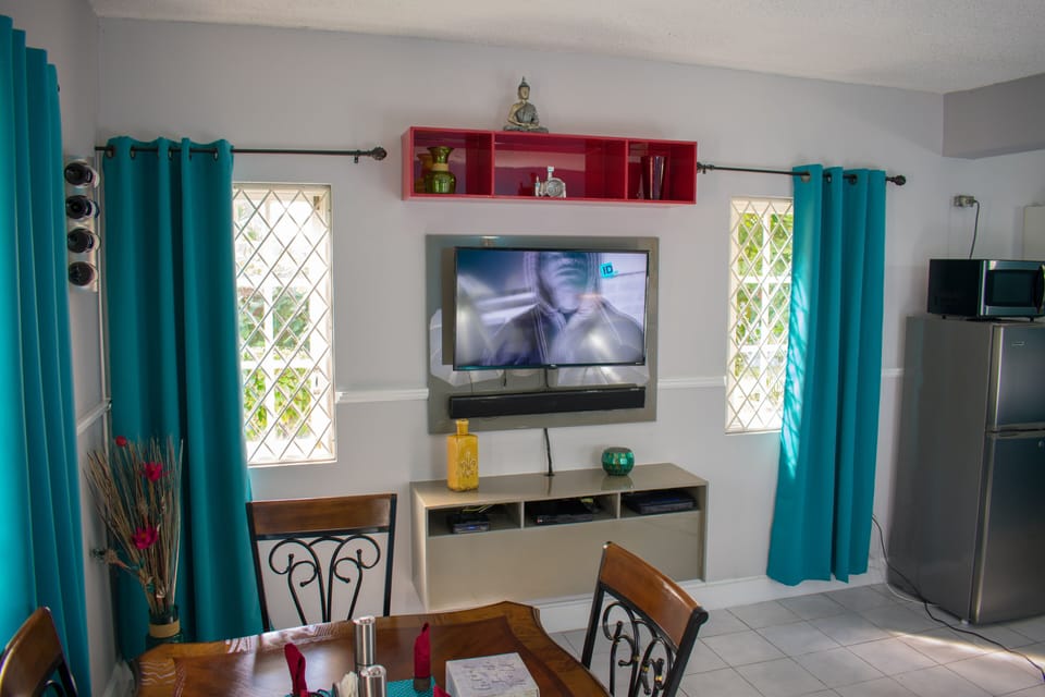 Apartment, Ground Floor | Living area | 50-inch flat-screen TV with cable channels, TV, DVD player