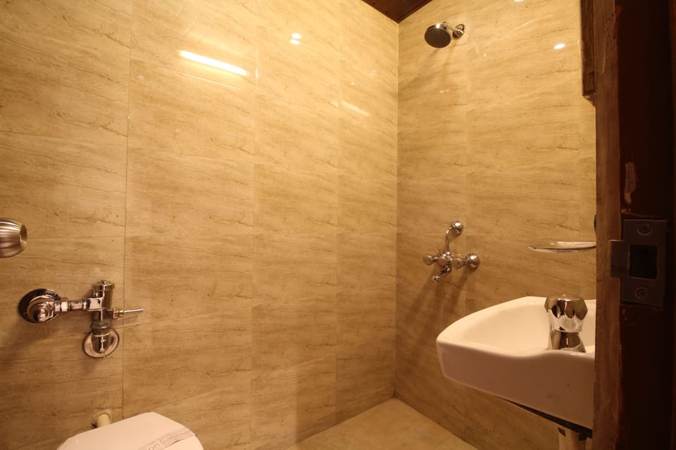 Triple Bed Non AC Room  | Bathroom | Shower, free toiletries, hair dryer, towels