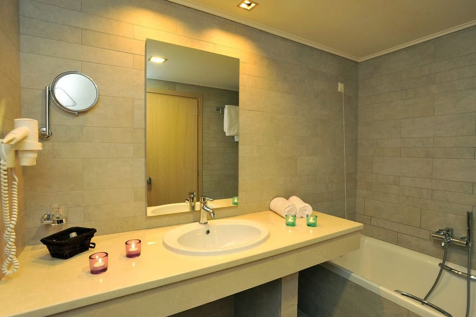 Bathtub, free toiletries, hair dryer, bathrobes
