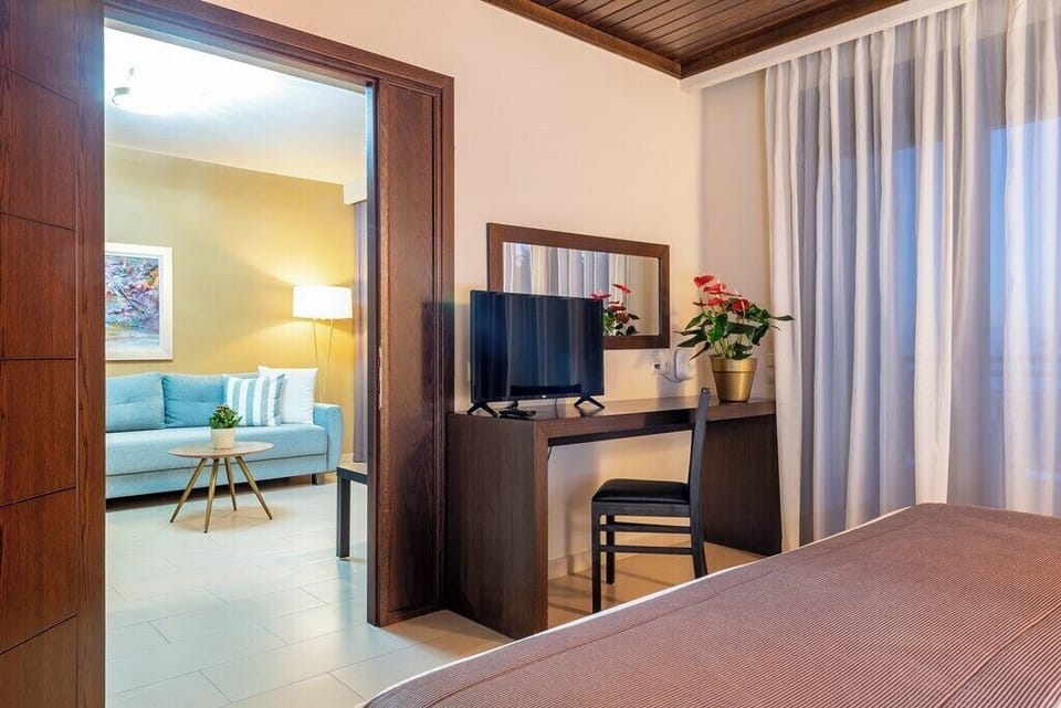 Deluxe Suite, Private Pool | Minibar, in-room safe, desk, laptop workspace