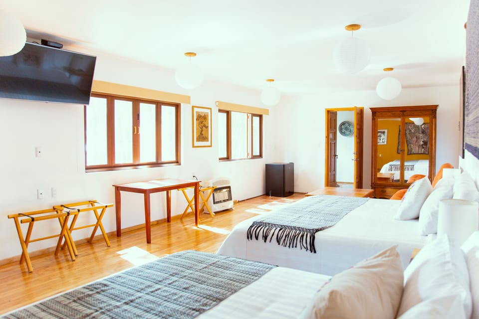 Deluxe Double Room, Multiple Beds | Down comforters, in-room safe, individually decorated