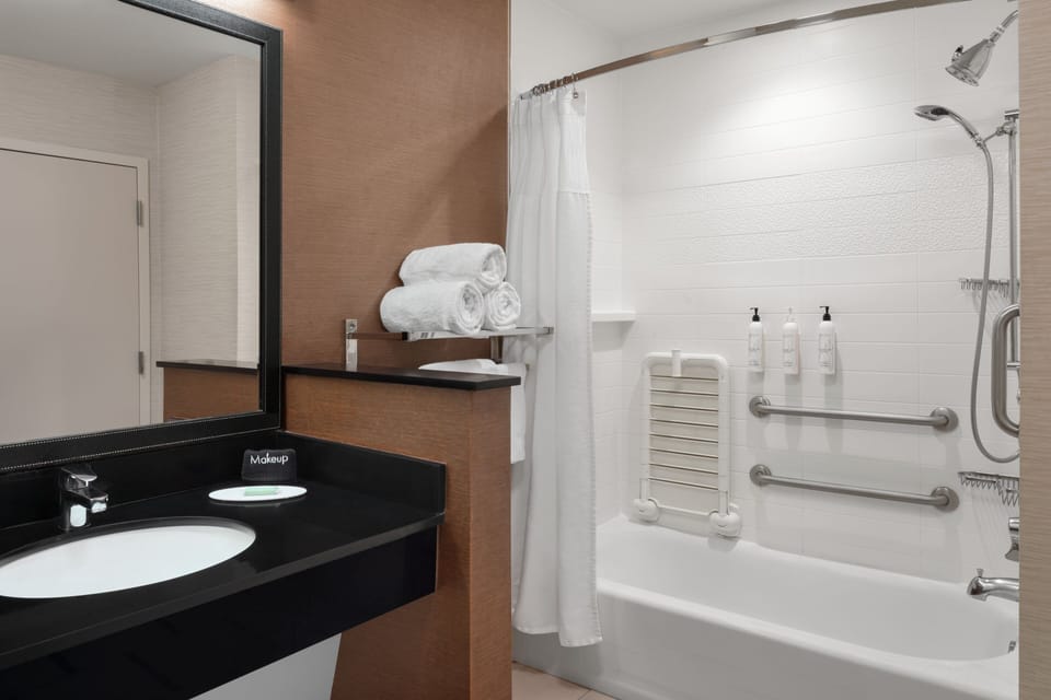 Suite, Multiple Beds | Bathroom | Combined shower/tub, hair dryer, towels