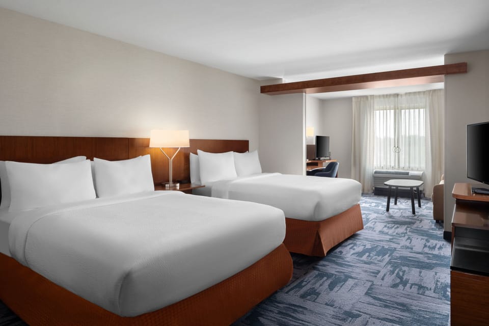 Suite, Multiple Beds | Desk, laptop workspace, blackout drapes, iron/ironing board