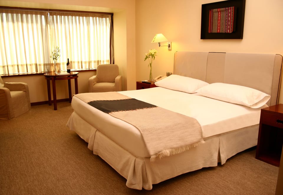 Premium bedding, down comforters, minibar, in-room safe
