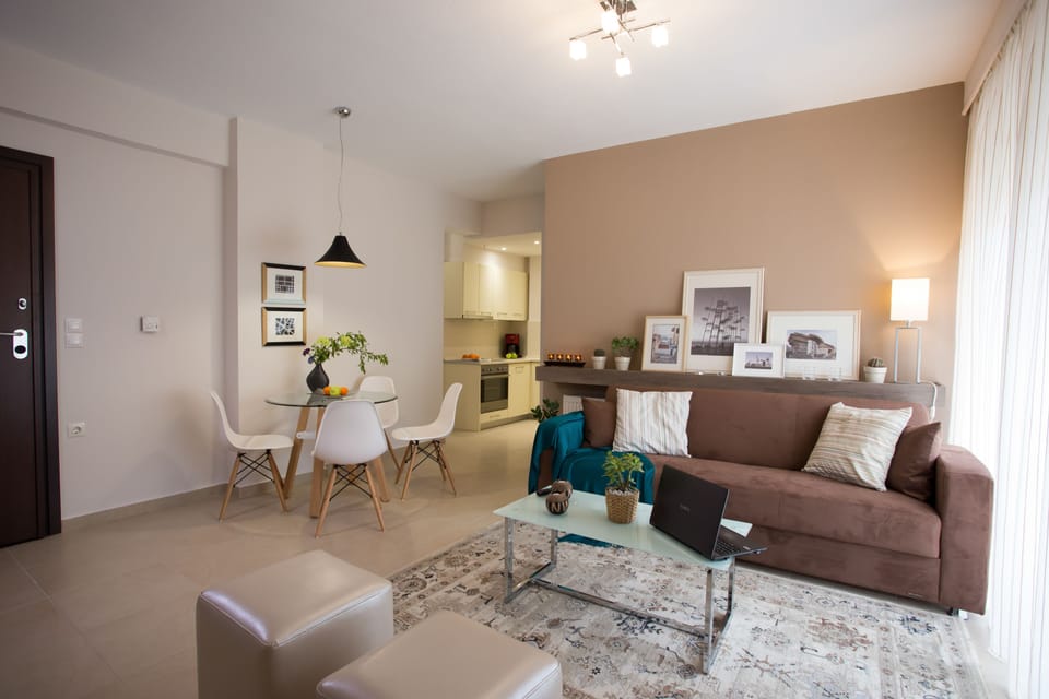 Deluxe Apartment, 2 Bedrooms | Living room | Plasma TV