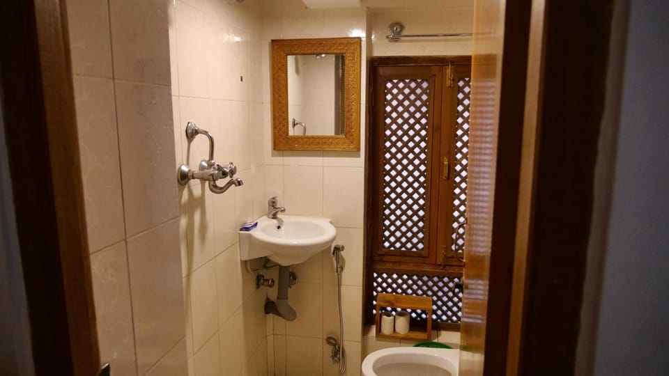 Shower, free toiletries, hair dryer, slippers