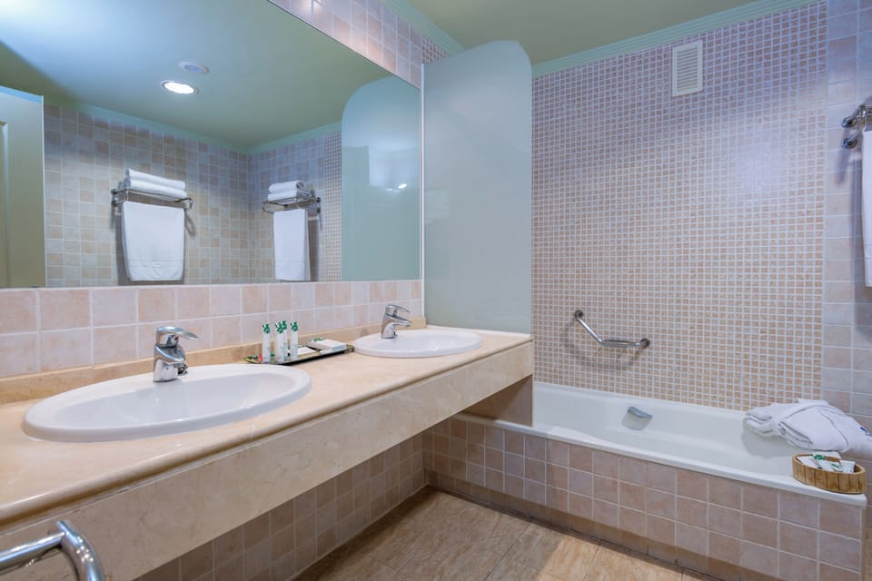 Separate tub and shower, eco-friendly toiletries, hair dryer, towels